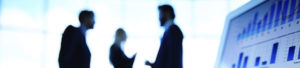 Office workers in conversation to promote Greenfield Risk Solutions Insurance Brokers - Financial Lines