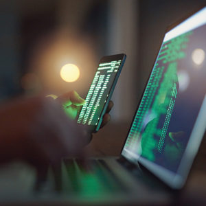 Data on phone and laptop to promote Greenfield Risk Solutions Insurance Brokers - IT and Technology - Cyber & Data Risks Insurance