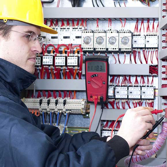 Electrician working on multiples meters to promote Greenfield Risk Solutions Insurance Brokers - Construction and Contractor Insurance - Electricians