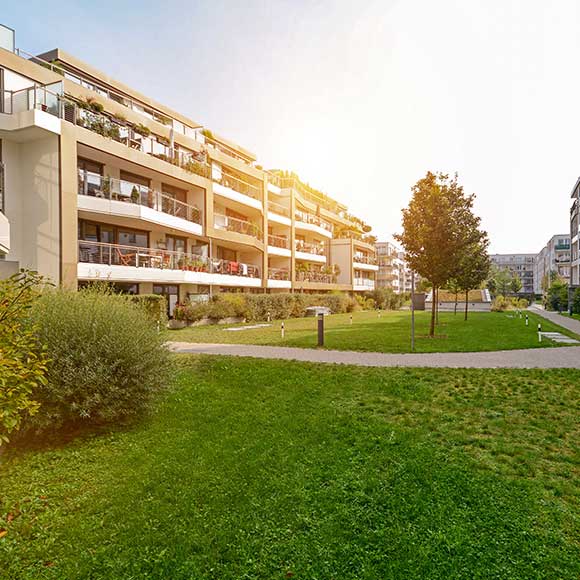 Banner_Products_Property_02-Block-of-Flats Attractive block of flats in sun to promote Greenfield Risk Solutions Insurance Brokers - Property Insurance - Block of Flates