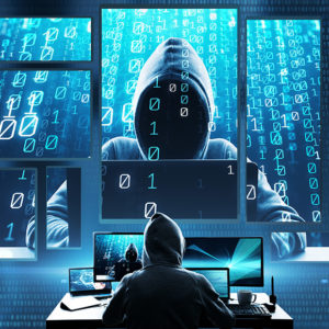 Cyber criminal hacking a system to promote Greenfield Risk Solutions Insurance Brokers - High risk and niche insurance - Cyber and Data Risks