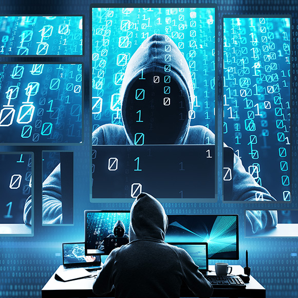 Cyber criminal hacking a system to promote Greenfield Risk Solutions Insurance Brokers - High risk and niche insurance - Cyber and Data Risks