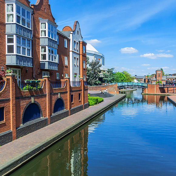 Modern homes by river to promote Greenfield Risk Solutions Insurance Brokers - Property Portfolio Insurance