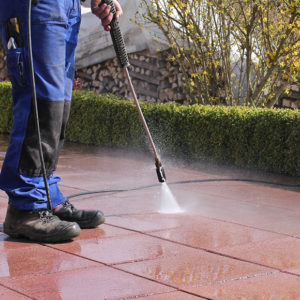 Ground being power-washed to promote Greenfield Risk Solutions - Specialist Risk and Contractors Insurance - Facilities Management