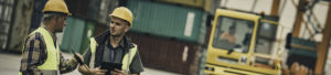 Two construction workers in conversation on-site to promote Greenfield Risk Solutions - Products