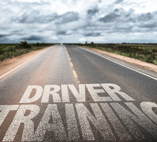 Driver Training written in white paint on the road to promote Greenfield Risk Solutions Insurance Brokers - Driver Training Insurance