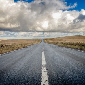 A vast expanse of open road surrounded by fields to promote Greenfield Risk Solutions Insurance Brokers- Driver Training Insurance