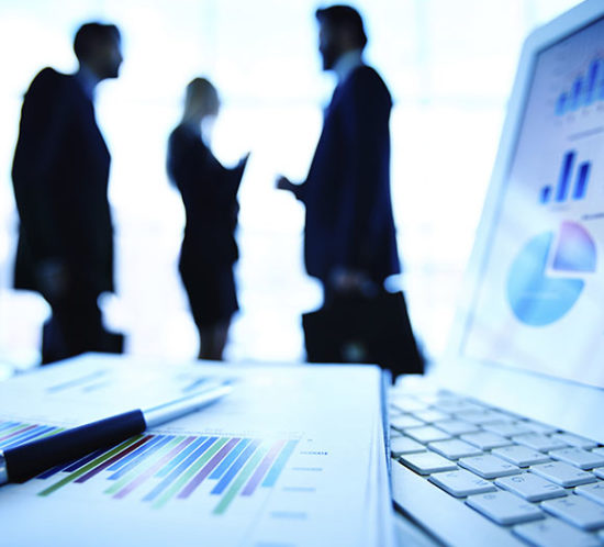 Office workers in conversation to promote Greenfield Risk Solutions Insurance Brokers - Financial Lines
