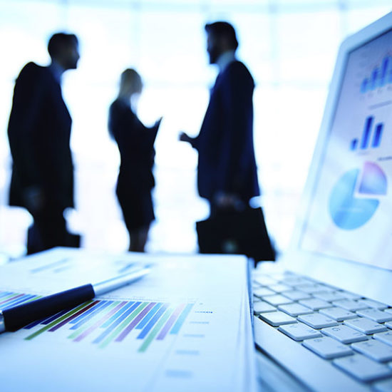 Office workers in conversation to promote Greenfield Risk Solutions Insurance Brokers - Financial Lines