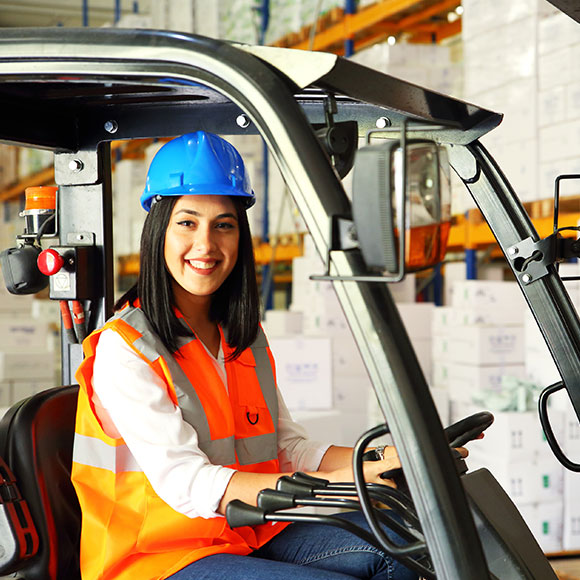 Female worker operating a PVC to promote Greenfield Risk Solutions Insurance Brokers Training Driver Scheme