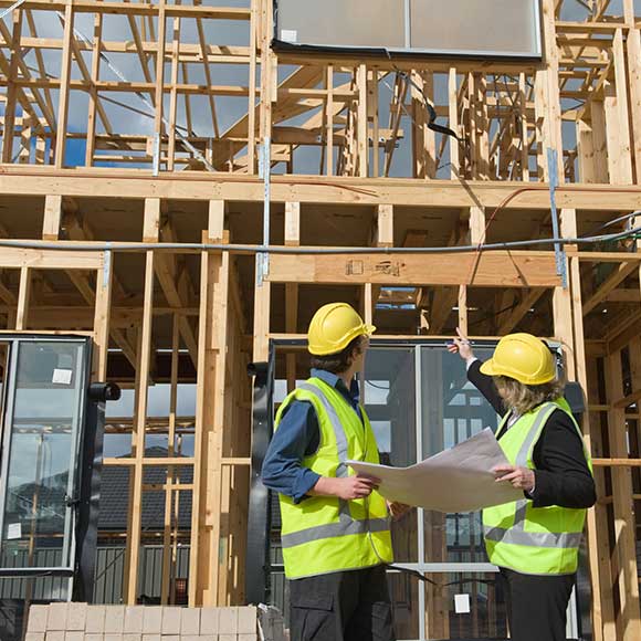 Construction workers evaluation in-progress building to promote Greenfield Risk Solutions Insurance Brokers - Construction and Contractors Insurance - Contract works